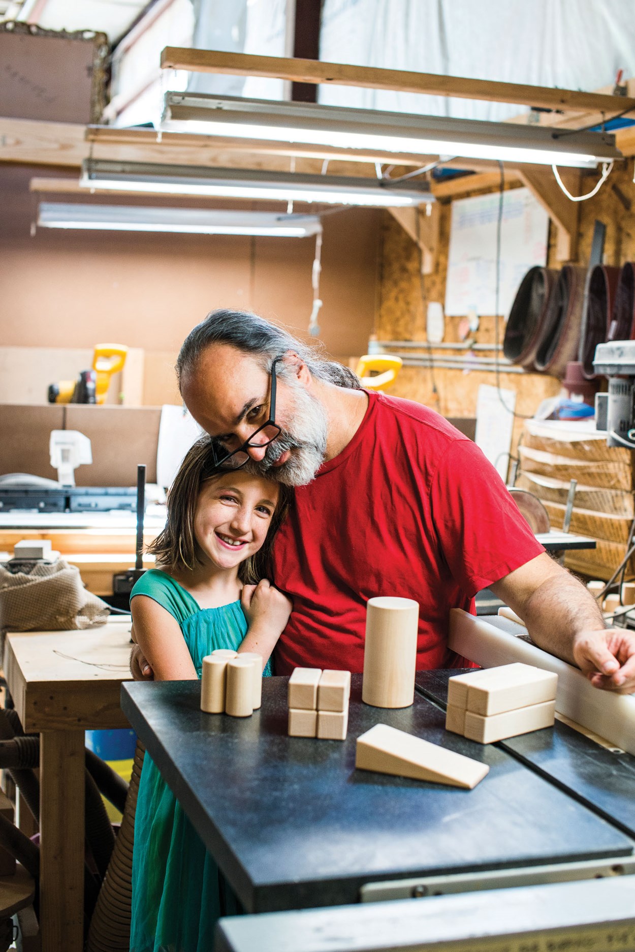 Pepi Acebo shown with his fabulous kiddo, from an article written by Paul M. Howey and published in Asheville Made, August 30, 2018. Photo by Karin Strickland. Used with permission.